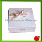 Luxury white paper gift box for tie with pink ribbon
