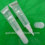 Lipstick container with brush clear tube packing