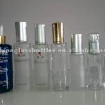 various glass cosmetic bottles with various pump