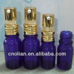 blue glass bottle with metal lotion pump