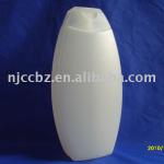 white hdpe plastic bottle of shampoo