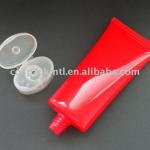 red oval flat cosmetic tube packaging cap