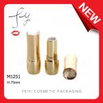 Shiny gold lipstick tube with diamond