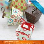 Folding cupcake boxes with ribbon handle