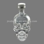 skull shaped glass bottle with screw neck