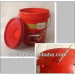 red paint bucket with red lid