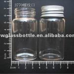 Customized clear glass bottle with aluminum twist off cap for packaging