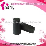 black cylinder shaped nail polish bottle cap