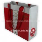 Red paper cloth bag with silk cloth handle